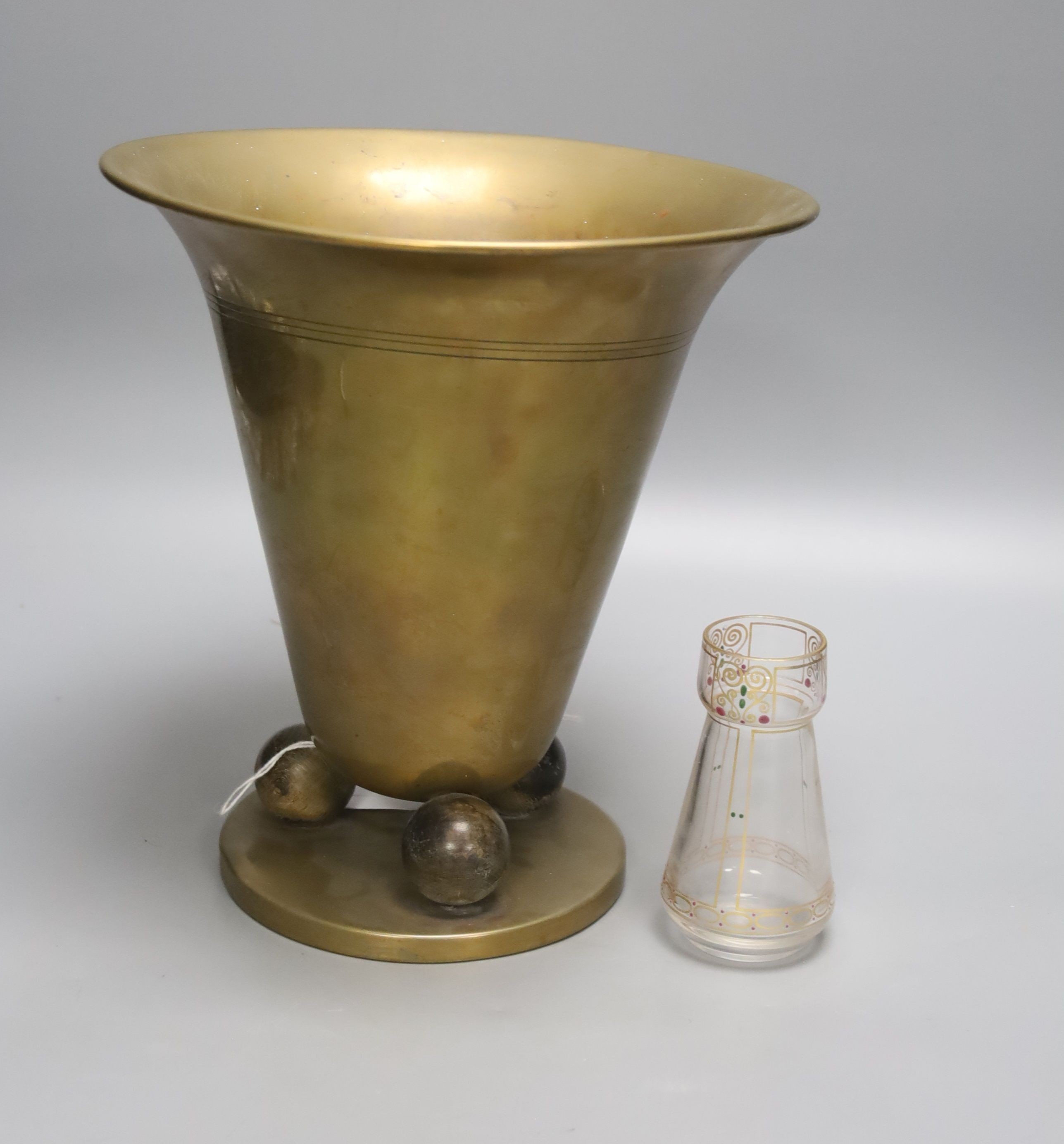 A Hoffman style brass vase and a small secessionist style glass vase, 24cm tall